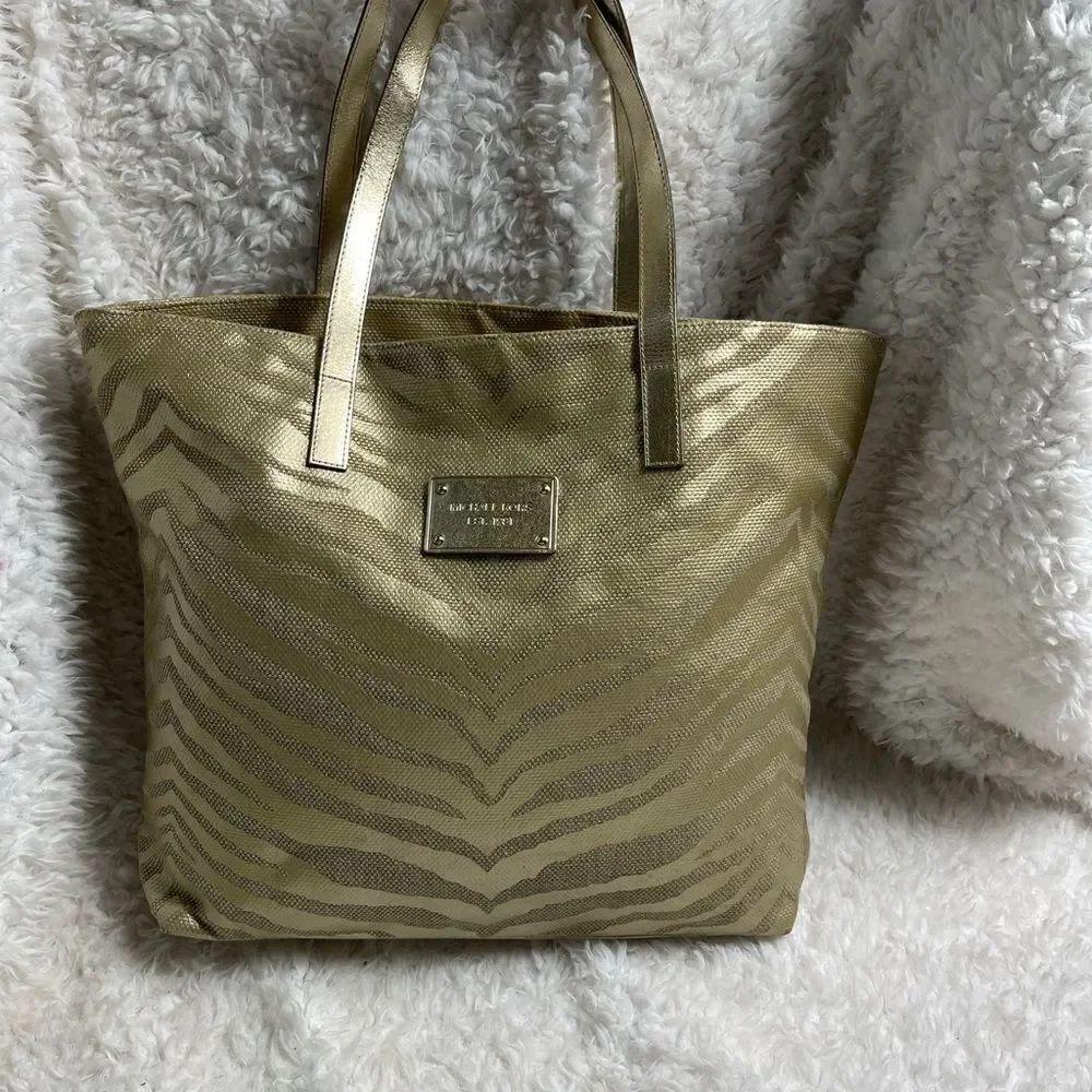 Michael Kors Metallic gold zebra print large tote gold tone hardwares and straps